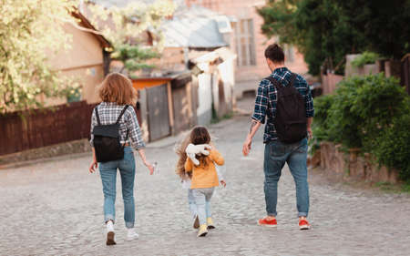 Young tourists family with their two lovely daughters walkingの写真素材