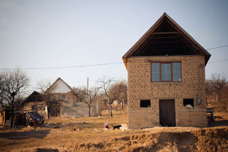 SEREDNIE, UKRAINE - MARCH 09, 2011: living in self-made simple adobe brick homeのeditorial素材
