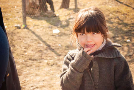 SEREDNIE, UKRAINE - MARCH 09, 2011: little Romani girl concockting a planのeditorial素材