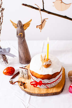 Easter cake and colored eggs on white backgroundの写真素材