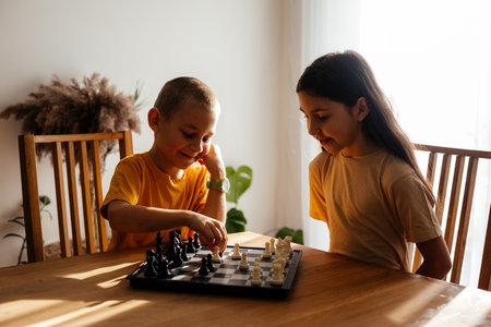 Kids having great time together playing chessの写真素材