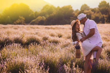 Lovely young couple embracing at the lavender fieldの写真素材