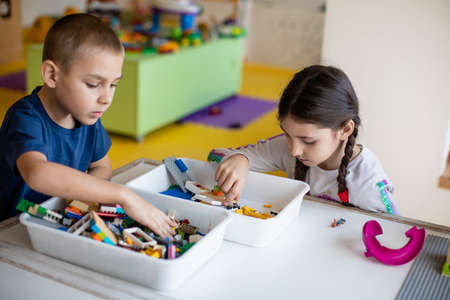 The kids are passionate about playing with a constructorの写真素材