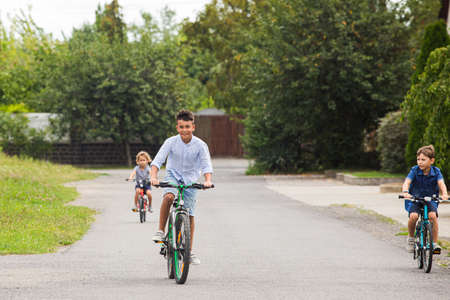 Kids have a leisure on bicycles outoodrsの写真素材