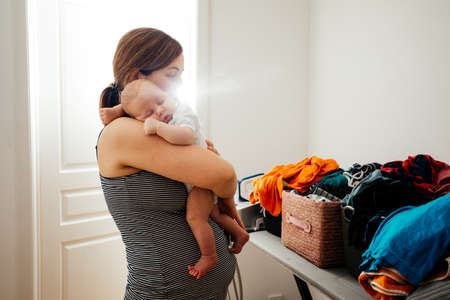 Adapting to new everyday realia being a motherの写真素材