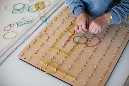 Exploring basic math and geometry concepts with geoboardの写真素材