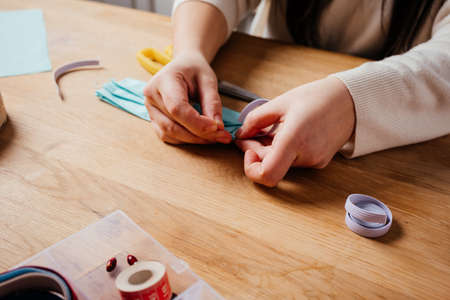 Hands sewing protective masks while self-isolation at homeの写真素材