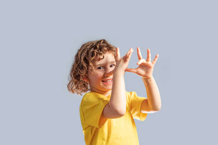 Adorable little girl with blond curly hair during fools day