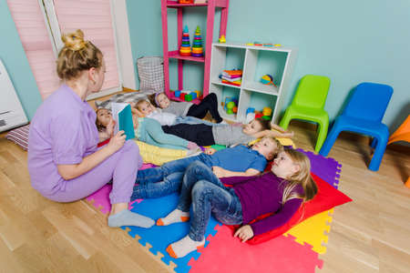 Time for reading stories at the daycareの写真素材