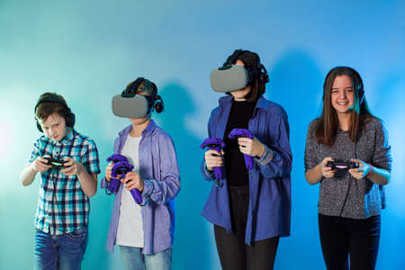 Group of kids using a gaming gadgets for virtual realityの写真素材