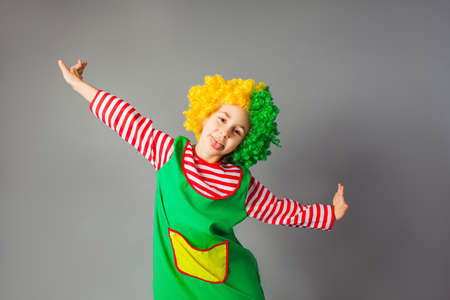 The funny little girl in a clown uniformの写真素材