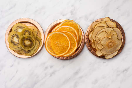 Different dried fruits heap on the tableの写真素材