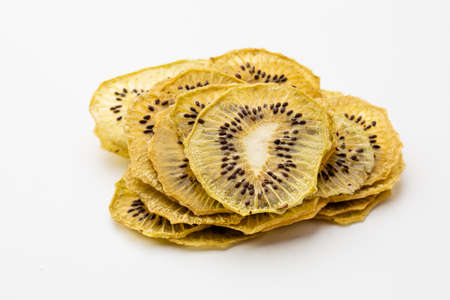 Kiwi dried fruits heap close up isolatedの写真素材
