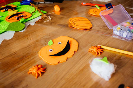 Funny Halloween pumpkins made of felt and paper, top viewの写真素材