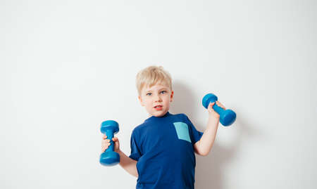 Active kids doing sport by following parents exampleの写真素材