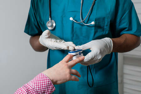 Doctor providing health check for patient after covid-19