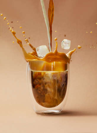 Cold coffee drink with ice and milkの写真素材