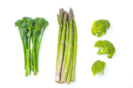 Raw broccolini at the row on white backgroundの写真素材