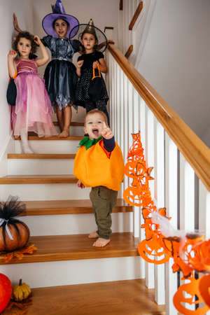 Girls in witch costumes ready for trick or treatingの写真素材
