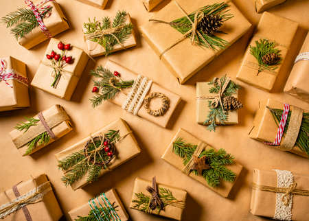 Woman decorates Christmas gifts with eco-friendly materials