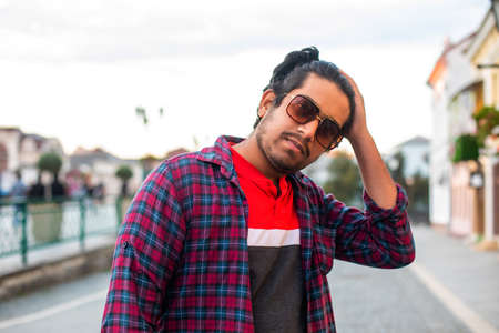 Stylish young man outdoors in the cityの写真素材