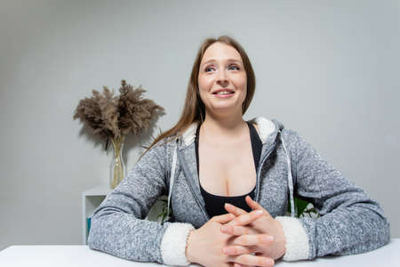 Distance relationship concept. Attractive woman connecting with romantic partner through technology