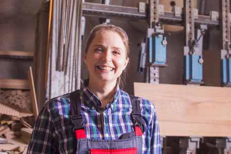 Self-confident woman engineer at woodworking plant indoorの写真素材