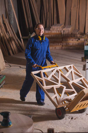 Piece of carved wood on hand truck