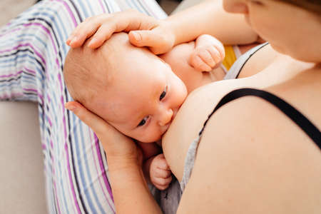 Mom and newborn baby resting after breastfeeding