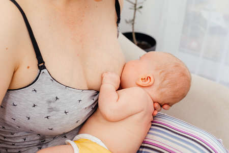 Mom and newborn baby resting after breastfeedingの写真素材