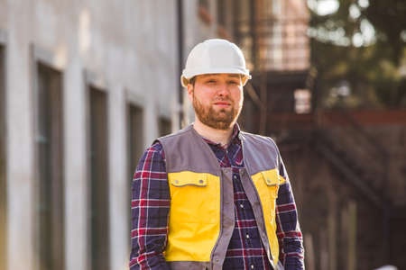 Factory worker posing in front of workshopの写真素材