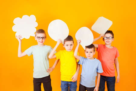 Thoughtful funny boys group with abstract idea clouds