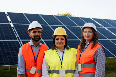 Coordinated work of young workers at the power plantの写真素材