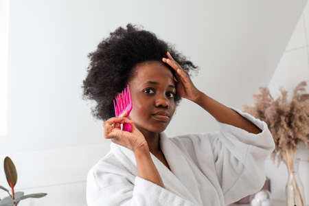 Charming smiling afro-american girl with messy hairの写真素材