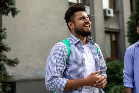 Young indian male student communicate with friends