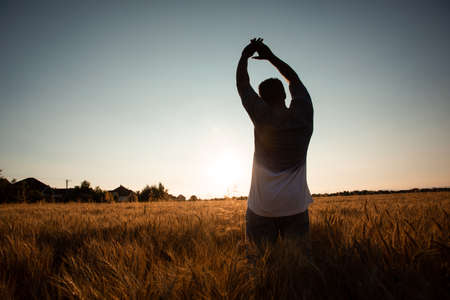 Farmer in the middle of the fieldの写真素材