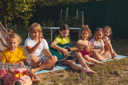 the children have a great time together in the backyard