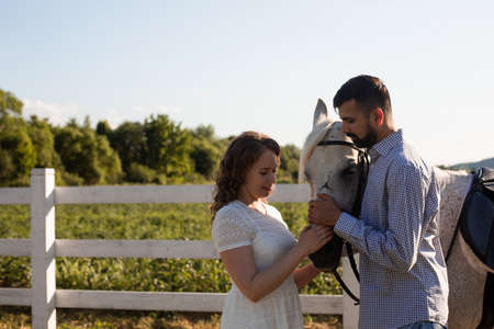 Couple walk at the ranch during summer dayの写真素材