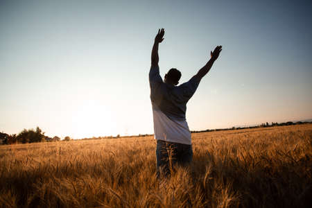 Farmer in the middle of the fieldの写真素材