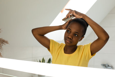 Everyday hair care routines for african girlの写真素材