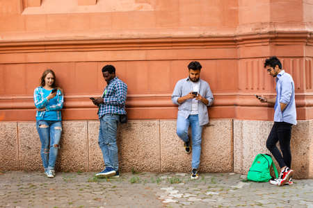 The young multi-ethnic people have a live stream in the city