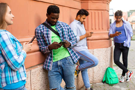 The young multi-ethnic people have a live stream in the cityの写真素材