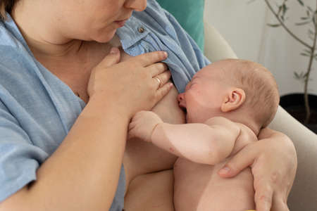The young mom wants to breastfeed her newborn baby