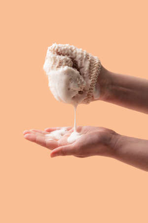 Natural biodegradable washcloth in the female hands