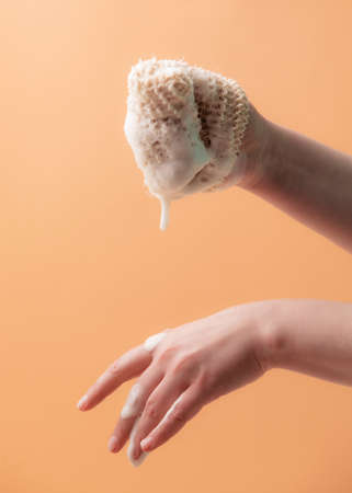 Natural biodegradable washcloth in the female handsの写真素材