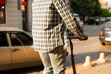 The man deftly rides an electric scooterの写真素材