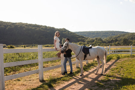 Couple walk at the ranch during summer dayの写真素材