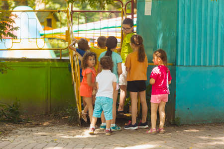 The kids are waiting for their turn to ride on the attractionの写真素材