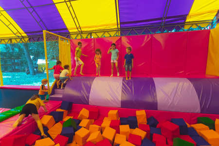 The children have a great time together in the trampoline parkの写真素材