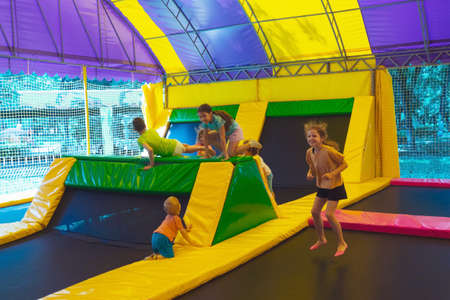 The happy child have a nice day in the trampoline parkの写真素材